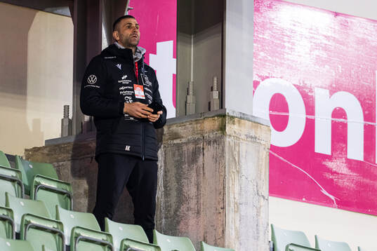 Head coach Azar Karadas of Start in the stands