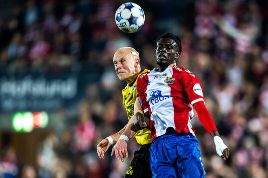 John Olav Norheim of Start and Massire Sylla of Lyn