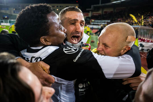 Head coach Azar Karadas of Start celebrates promotion to