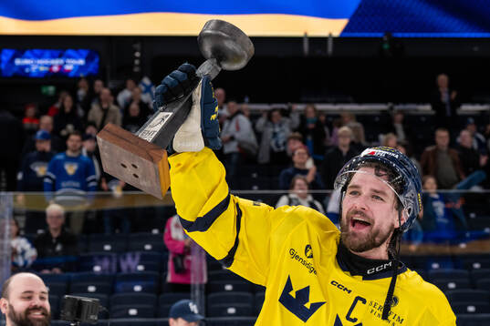 Linus Johansson of Sweden celebrates with the trophy