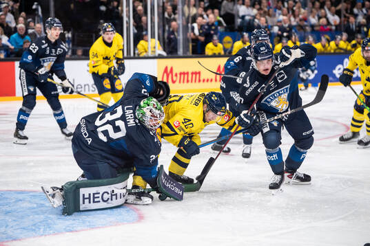 Emil Larmi and Julius Honka of Finland against Andreas