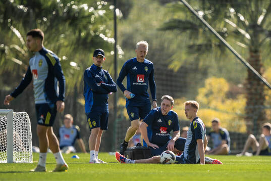 Hugo Larsson of the Swedish national football team receives