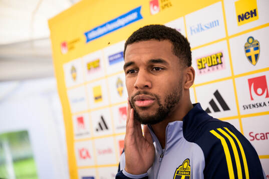 Isak Hien of the Swedish national football team talking to