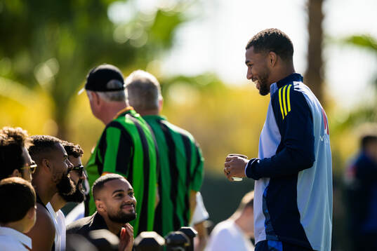 Isak Hien of the Swedish national football team interacting