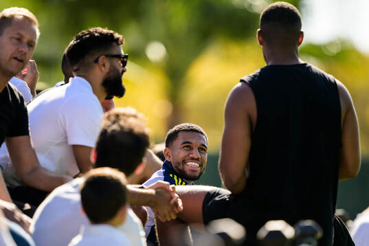 Isak Hien of the Swedish national football team interacting