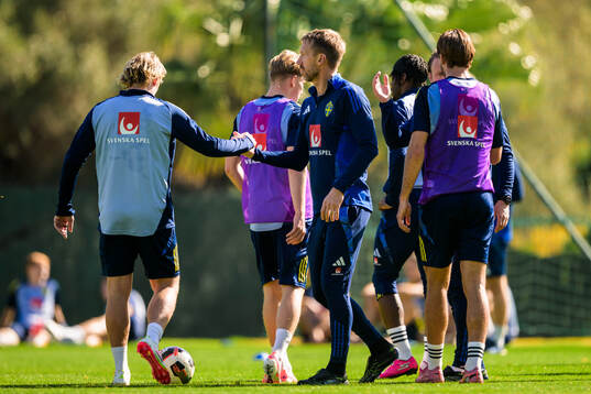 Head coach Graham Potter greets Emil Forsberg of the