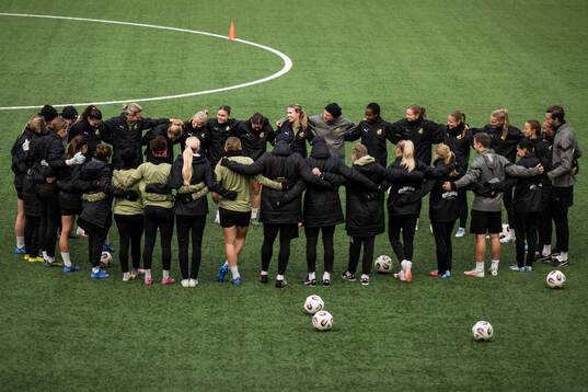Players and coaches gather
