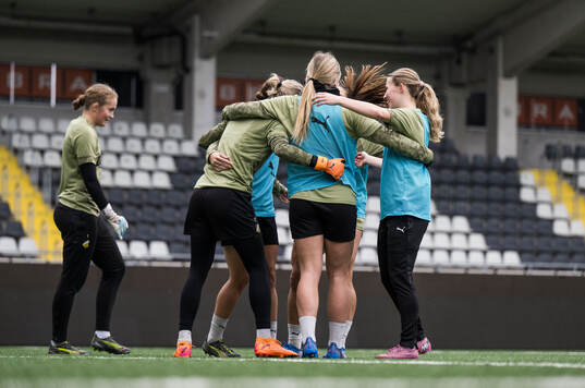Goalkeeper Jennifer Falk celebrates with team mates