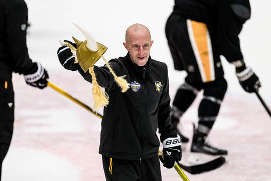 Head coach Dan Muse with a toy viking helmet
