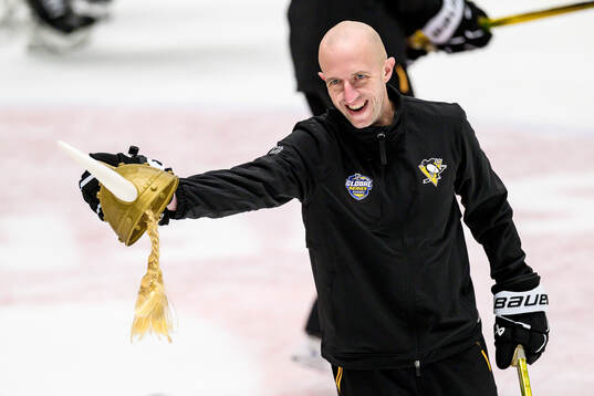 Head coach Dan Muse with a toy viking helmet