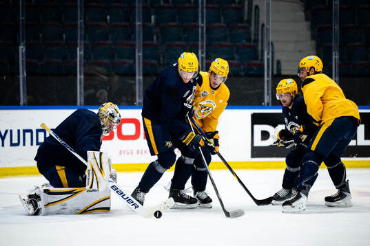 Goaltender Justus Annunen, Michael McCarron and Brady Skjei
