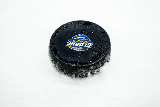 A puck witl the NHL Global Series logo