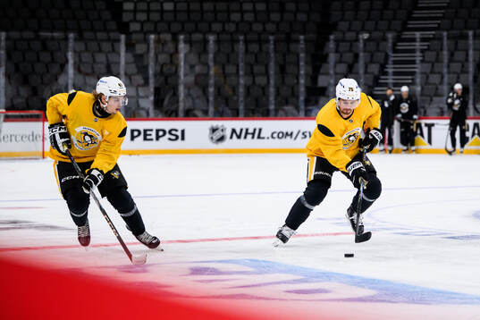 Ville Koivunen and Connor Clifton