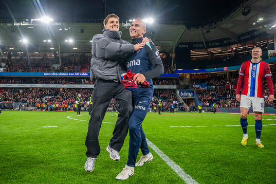 Martin Ødegaard and Leo Østigård of Norway celebrate