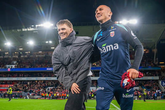 Martin Ødegaard and Leo Østigård of Norway celebrate
