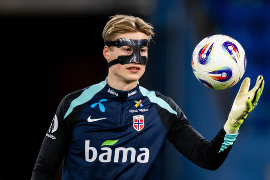 Goalkeeper Sander Tangvik of Norway warms up