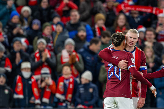 Erling Braut Haaland of Norway celebrates with teammate