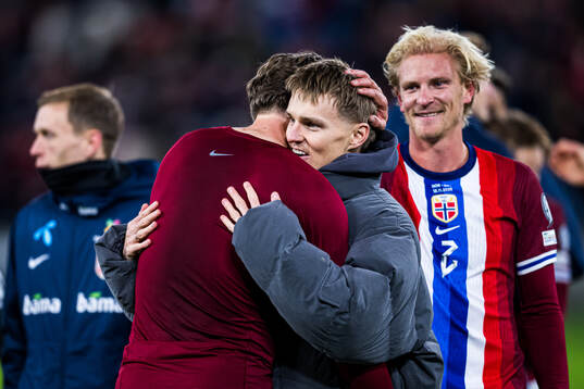 Martin Ødegaard of Norway celebrates with Sander Berge