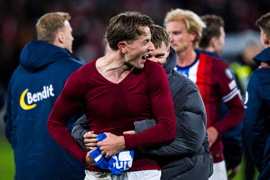 Martin Ødegaard of Norway celebrates with Sander Berge