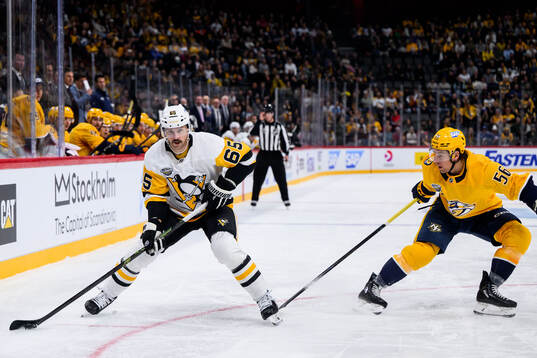 Erik Karlsson of Pittsburgh Penguins and Erik Haula of