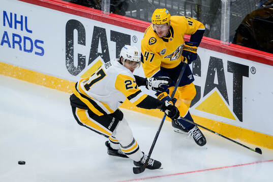 Ryan Graves of Pittsburgh Penguins and Michael McCarron of