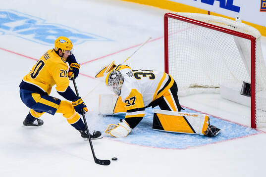Justin Barron of Nashville Predators and goalkeeper Arturs