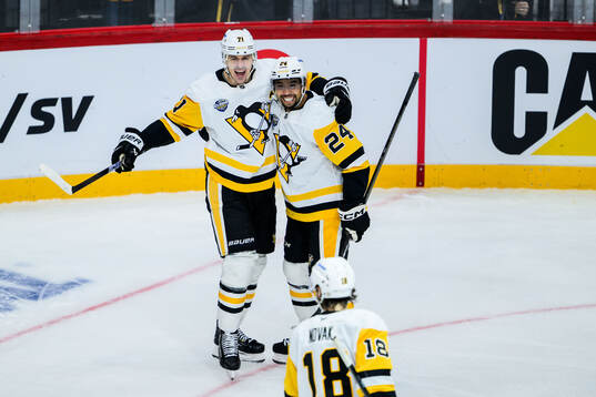 Evgeni Malkin and Mathew Dumba of Pittsburgh Penguins
