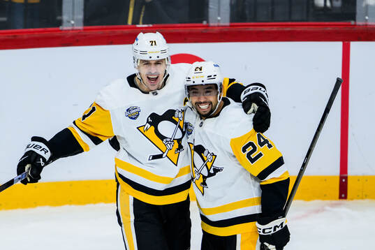 Evgeni Malkin and Mathew Dumba of Pittsburgh Penguins