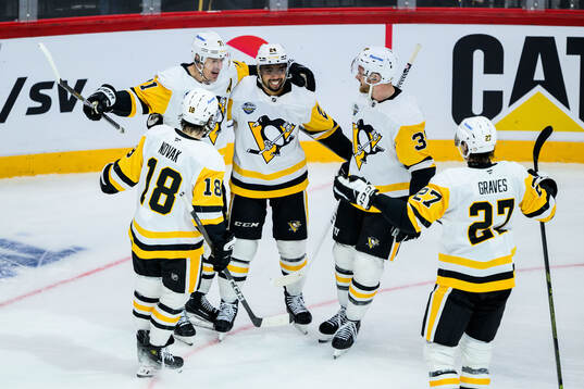Evgeni Malkin celebrate with Tommy Novak and Mathew Dumba