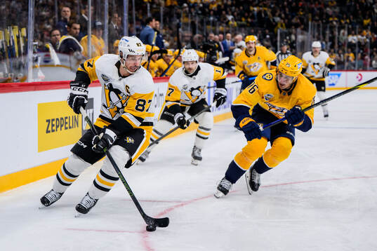 Sidney Crosby of Pittsburgh Penguins and Brady Skjei of