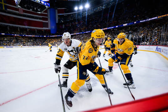 Sidney Crosby of Pittsburgh Penguins with Luke Evangelista