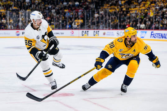 Erik Karlsson of Pittsburgh Penguins and Ryan O'Reilly of
