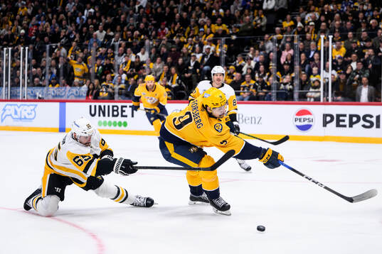 Erik Karlsson of Pittsburgh Penguins and Filip Forsberg of