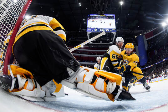 Kris Letang of Pittsburgh Penguins and Michael Bunting of