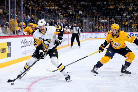 Erik Karlsson of Pittsburgh Penguins and Erik Haula of