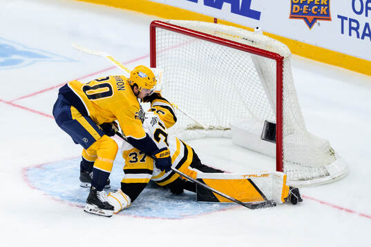 Justin Barron of Nashville Predators and goalkeeper Arturs