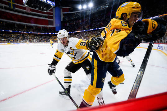 Sidney Crosby of Pittsburgh Penguins and Luke Evangelista
