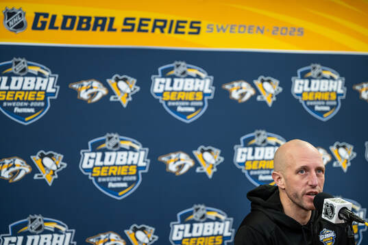 Head coach Dan Muse at a press conference