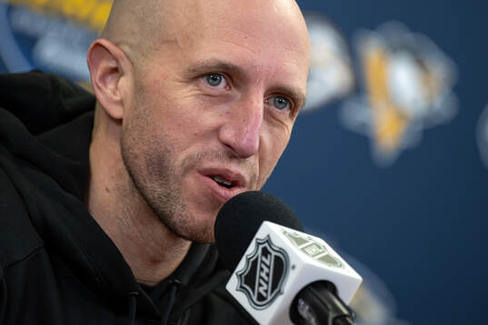 Head coach Dan Muse at a press conference