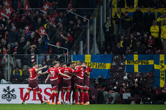 Players of Switzerland celebrate the 1-0 goal by Breel
