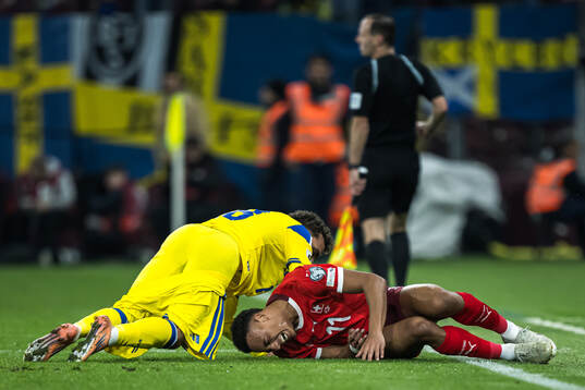 Yasin Ayari of Sweden and Dan Ndoye of Switzerland