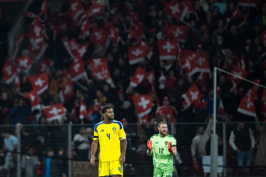 Isak Hien and goalkeeper Viktor Johansson of Switzerland