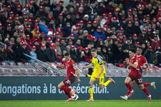 Granit Xhaka, Fabian Rieder, and Dan Ndoye of Switzerland