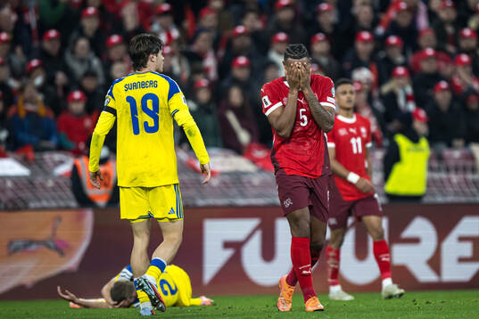 Manuel Akanji of Switzerland looks dejected