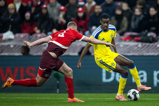 Nico Elvedi of Switzerland and Alexander Isak of Sweden
