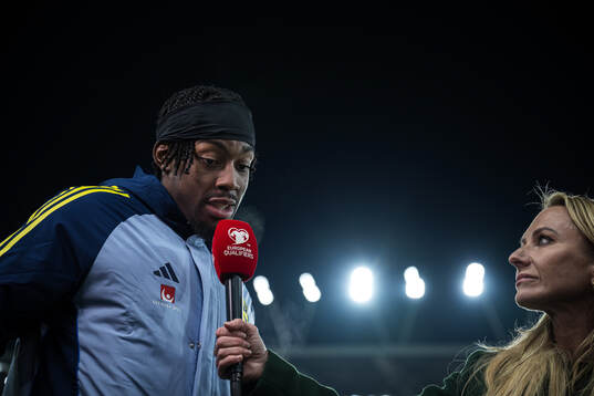 Anthony Elanga of Sweden with Frida Nordstand in the