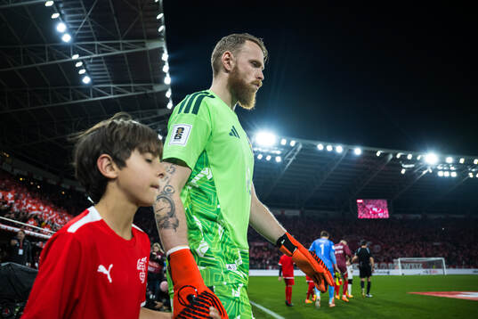 Goalkeeper Viktor Johansson of Sweden enters the pitch for