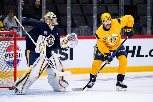 goaltender Justus Annunen and Filip Forsberg at a practice