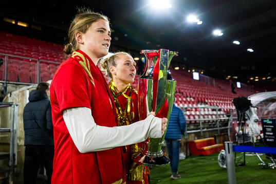 Signe Gaupset of Brann celebrates with the trophy