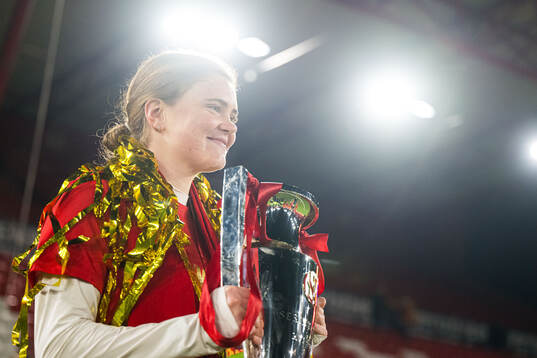 Signe Gaupset of Brann celebrates with the trophy